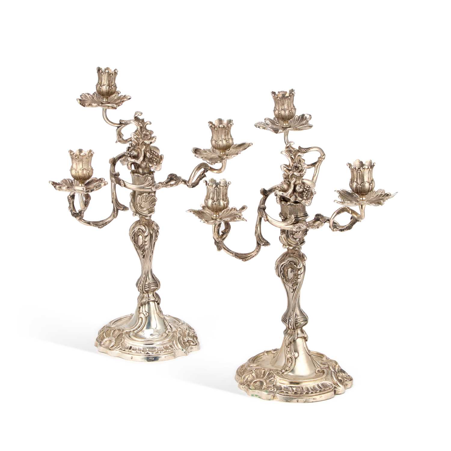 Lot A PAIR OF 18TH CENTURY GERMAN SILVER THREE-LIGHT CANDELABRA