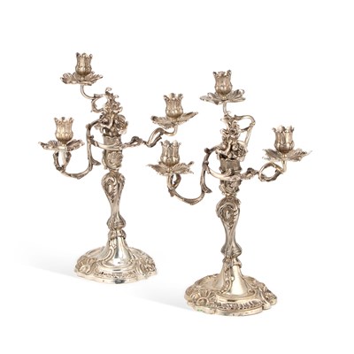Lot A PAIR OF 18TH CENTURY GERMAN SILVER THREE-LIGHT CANDELABRA