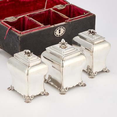 Lot A SET OF TWO CASED GEORGE III SILVER TEA CADDIES AND A SUGAR BOX