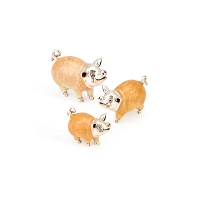 Lot 242 - A SET OF THREE SILVER AND ENAMEL MODELS OF PIGS