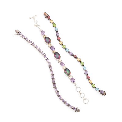 Lot 246 - THREE SILVER GEM-SET BRACELETS