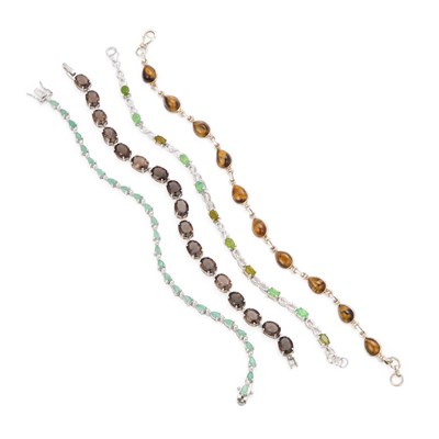 Lot 306 - FOUR VARIOUS GEM-SET LINE BRACELETS