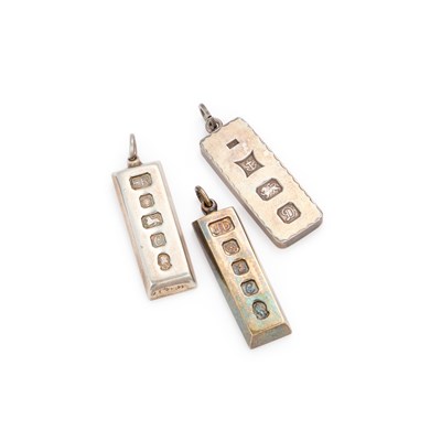 Lot 317 - THREE SILVER INGOT PENDANTS