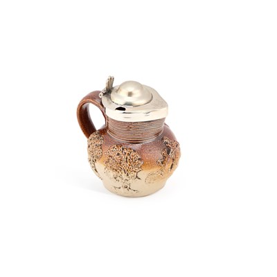 Lot 453 - A GEORGE III SILVER-MOUNTED SALT-GLAZED STONEWARE CONDIMENT JUG