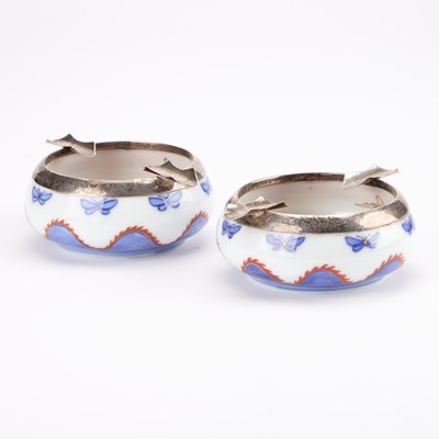 Lot 104 - A PAIR OF JAPANESE FUKAGAWA PORCELAIN AND ENGLISH SILVER ASHTRAYS