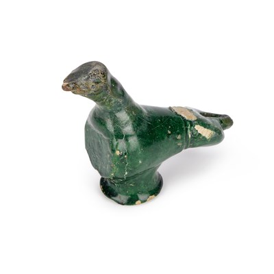 Lot 33 - AN UMAYYAD GREEN-GLAZED POTTERY OIL LAMP IN THE FORM OF A BIRD