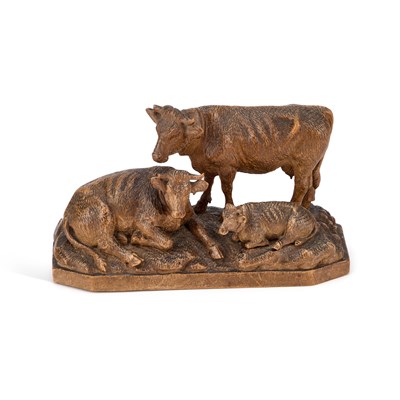 Lot 647 - A LATE 19TH CENTURY SWISS CARVED LINDEN WOOD GROUP OF COWS
