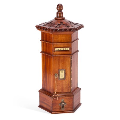Lot 669 - A CARVED MAHOGANY HEXAGONAL PILLAR LETTER BOX
