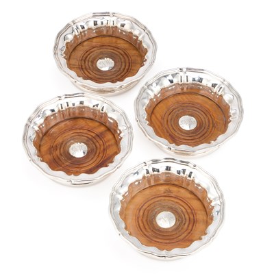 Lot 302 - A GOOD SET OF FOUR VICTORIAN SILVER WINE COASTERS