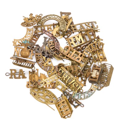 Lot 22 - A GROUP OF MILITARY SHOULDER TITLES/ BADGES