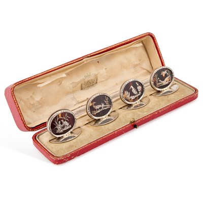 Lot 250 - A SET OF FOUR GEORGE V SILVER AND TORTOISESHELL MENU HOLDERS