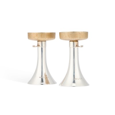 Lot 232 - CHRISTOPHER NIGEL LAWRENCE, A PAIR OF ELIZABETH II PARCEL-GILT SILVER CANDLESTICKS