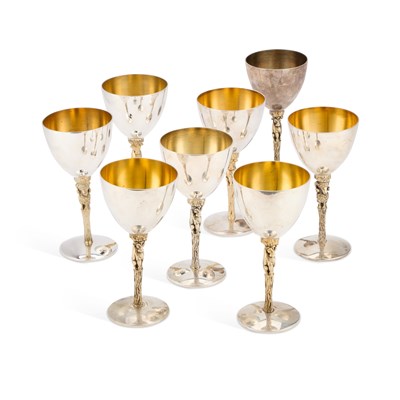 Lot 226 - STUART DEVLIN, EIGHT PARCEL-GILT SILVER TOTEM WINE GOBLETS