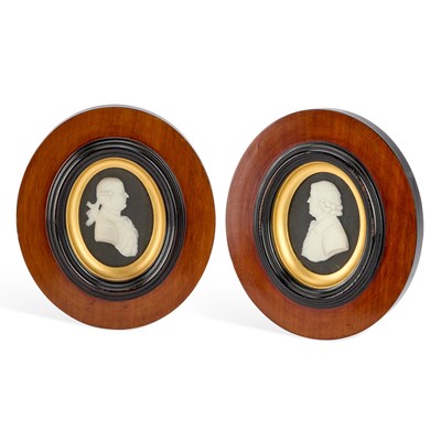 Lot 37 - A PAIR OF WEDGWOOD BLACK JASPER PORTRAIT PLAQUES OF JOSIAH WEDGWOOD AND THOMAS BENTLEY