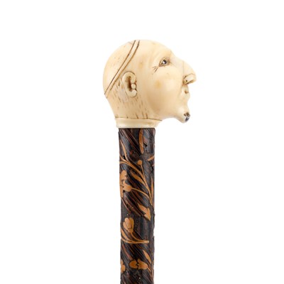 Lot 515 - A 19TH CENTURY IVORY-HANDLED MARQUETRY CANE