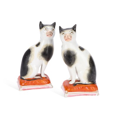 Lot 38 - A RARE PAIR OF STAFFORDSHIRE POTTERY MODELS OF CATS