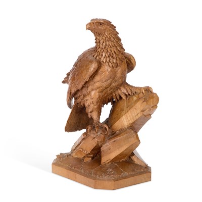 Lot 560 - A BLACK FOREST CARVED WALNUT EAGLE