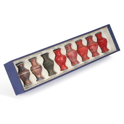 Lot 66 - A DIORAMA OF EIGHT CHINESE VASES SHOWING CINNABAR LACQUER VASES SHOWING THE STAGES OF PRODUCTION