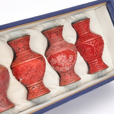 Lot 66 - A DIORAMA OF EIGHT CHINESE VASES SHOWING CINNABAR LACQUER VASES SHOWING THE STAGES OF PRODUCTION