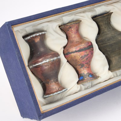 Lot 66 - A DIORAMA OF EIGHT CHINESE VASES SHOWING CINNABAR LACQUER VASES SHOWING THE STAGES OF PRODUCTION