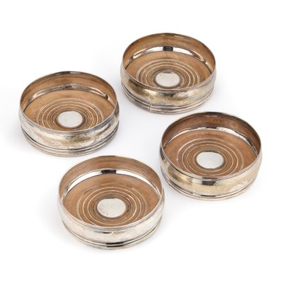 Lot 359 - A SET OF FOUR GEORGE III SILVER WINE COASTERS