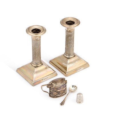 Lot 129 - A PAIR OF GEORGE V SILVER COLUMNAR CANDLESTICKS