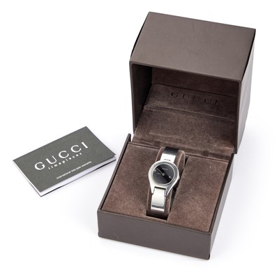 Lot 156 - A LADY'S STEEL GUCCI BANGLE WATCH