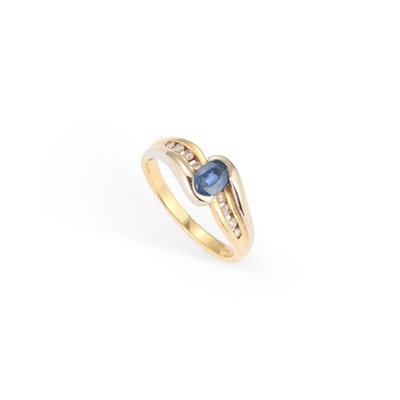 Lot 448 - AN 18 CARAT GOLD SAPPHIRE AND DIAMOND RING