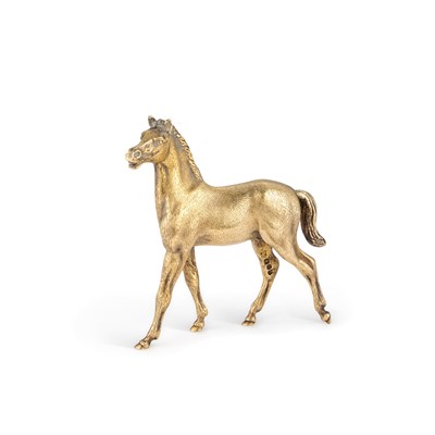 Lot 180 - AN ELIZABETH II CAST SILVER-GILT MODEL OF A HORSE