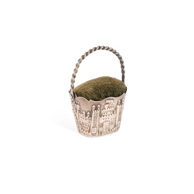 Lot 313 - A 19TH CENTURY SILVER CASTLE-TOP BASKET PIN-CUSHION