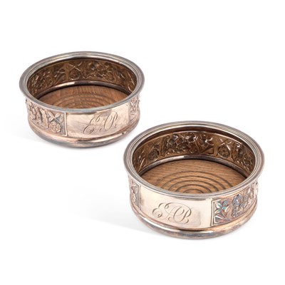 Lot 250 - A PAIR OF ELIZABETH II SILVER BOTTLE COASTERS