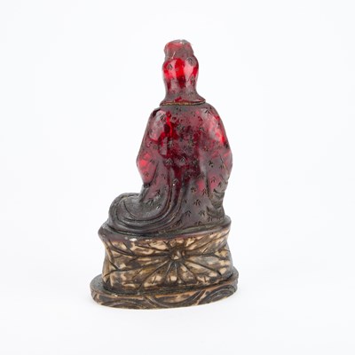 Lot 715 - A CHINESE FAUX AMBER FIGURE OF BUDDHA