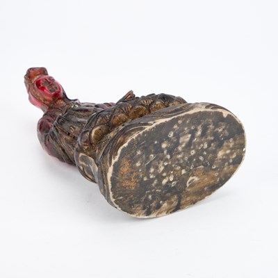 Lot 715 - A CHINESE FAUX AMBER FIGURE OF BUDDHA