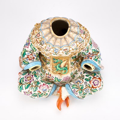Lot 87 - A 19TH CENTURY CONTINENTAL PORCELAIN PAGODA FIGURE BASE
