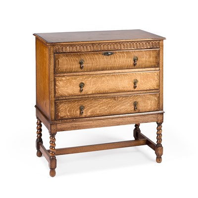 Lot 670 - A 1920S OAK CHEST OF DRAWERS