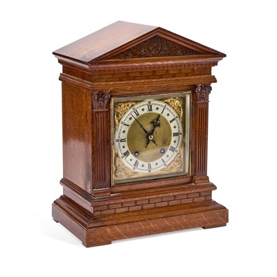 Lot 300 - A GERMAN OAK TWO-TRAIN MANTEL CLOCK