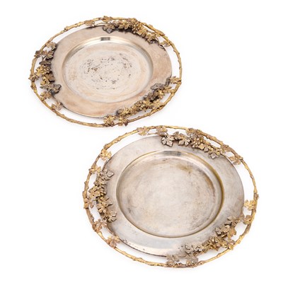 Lot 75 - A PAIR OF ITALIAN PARCEL-GILT SILVER-PLATED SERVING PLATES
