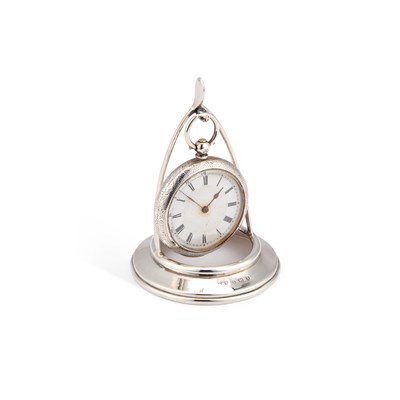 Lot 243 - A SILVER POCKET WATCH ON A SILVER STAND