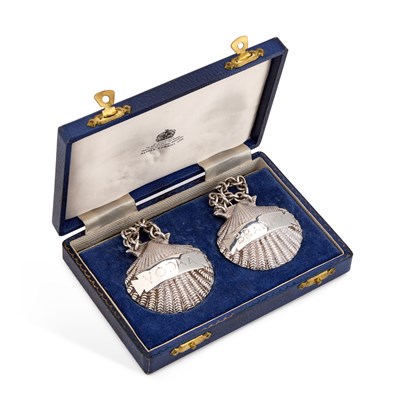 Lot 226 - A PAIR OF ELIZABETH II CAST SILVER DECANTER LABELS