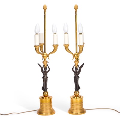 Lot 616 - A PAIR OF BRONZE AND ORMOLU THREE-LIGHT TABLE LAMPS