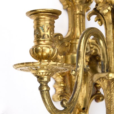 Lot A GOOD SET OF FOUR GILT-BRONZE THREE-LIGHT WALL SCONCES