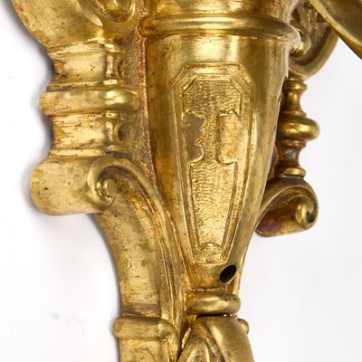 Lot A GOOD SET OF FOUR GILT-BRONZE THREE-LIGHT WALL SCONCES