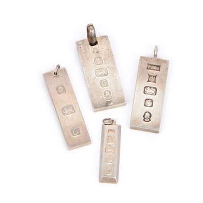 Lot 653 - FOUR SILVER INGOT PENDANTS