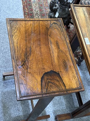 Lot 1037 - A SET OF THREE GEORGE IV ROSEWOOD PILLAR-END NESTING TABLES