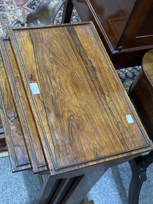 Lot 1037 - A SET OF THREE GEORGE IV ROSEWOOD PILLAR-END NESTING TABLES