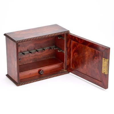 Lot 1087 - A 19TH CENTURY FIGURED MAHOGANY TABLE CABINET