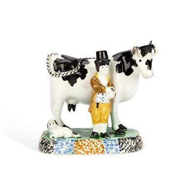 Lot 24 - A PRATT TYPE MODEL OF A COW AND ATTENDANT