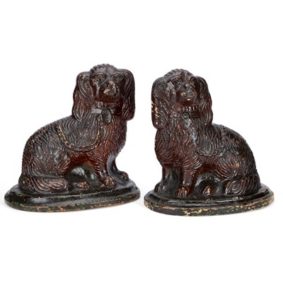 Lot 89 - A LARGE PAIR OF BROWN-GLAZED STONEWARE MODELS OF SEATED SPANIELS