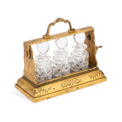 Lot 209 - A SMALL BETJEMANN'S PATENT ENGRAVED GILT-BRASS THREE-BOTTLE TANTALUS