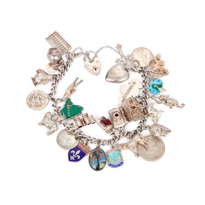 Lot 630 - A SILVER CHARM BRACELET